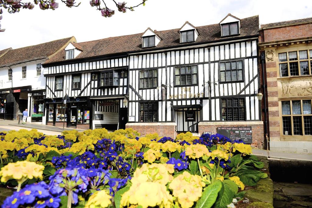 
a bouquet of flowers in front of a building at White Hart Hotel in St. Albans
