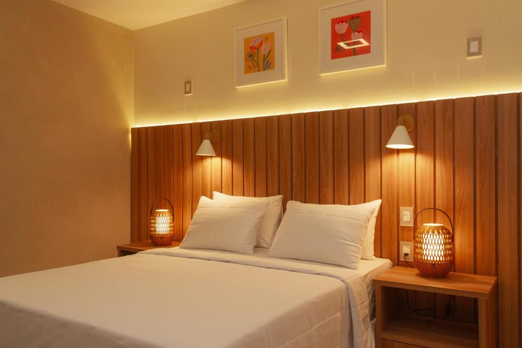 Postel nebo postele na pokoji v ubytování Principe do Mutá Hotel Design