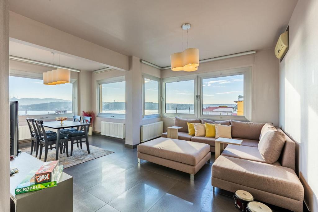 a living room with a couch and a table at Stylish Apartment with Bosphorus View in Besiktas in Istanbul