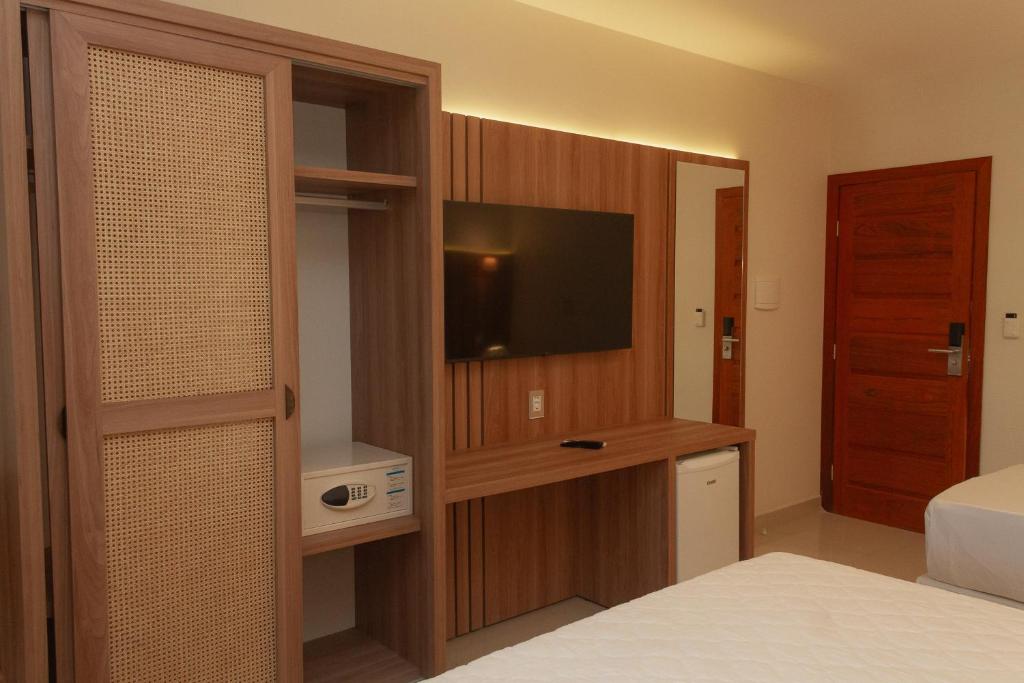 Postel nebo postele na pokoji v ubytování Principe do Mutá Hotel Design