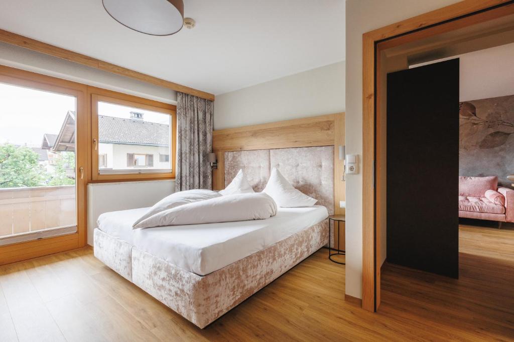 Postel nebo postele na pokoji v ubytování hin&weg das Aparthotel