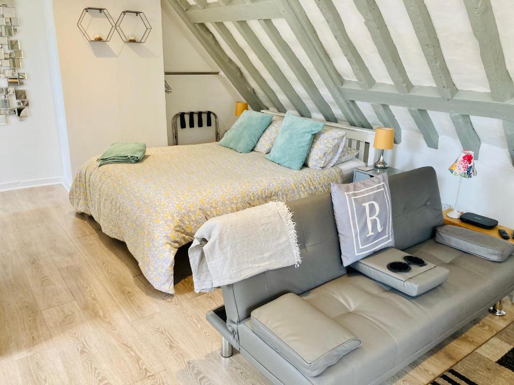 a bedroom with a bed and a couch in it at Rother - Studio in Rye - LOCATION,LOCATION,LOCATION !!! in Rye