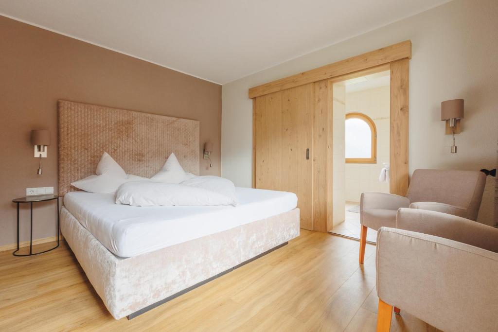 Postel nebo postele na pokoji v ubytování hin&weg das Aparthotel