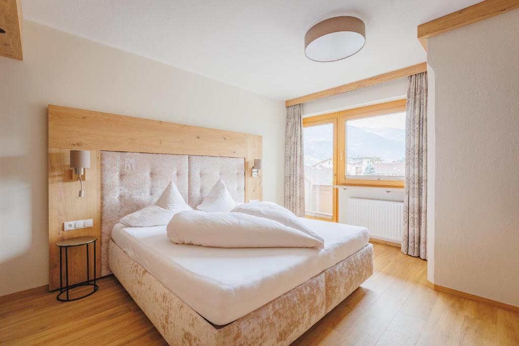 Postel nebo postele na pokoji v ubytování hin&weg das Aparthotel