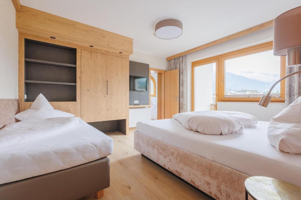 Postel nebo postele na pokoji v ubytování hin&weg das Aparthotel