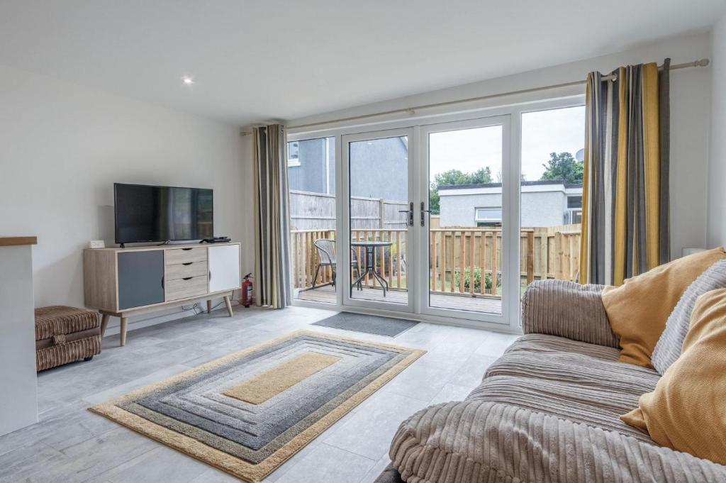 Posezení v ubytování The Garden Lodge - 1 Bedroom Lodge - Tenby