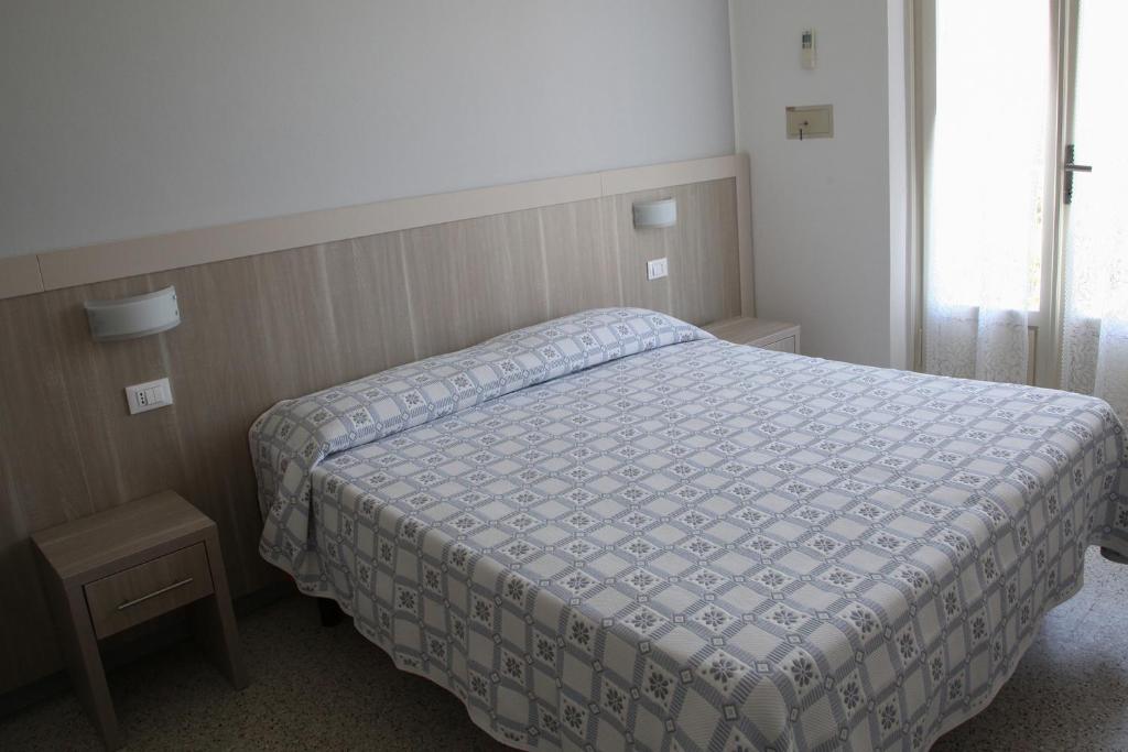 Postel nebo postele na pokoji v ubytování Hotel Annita Cervia