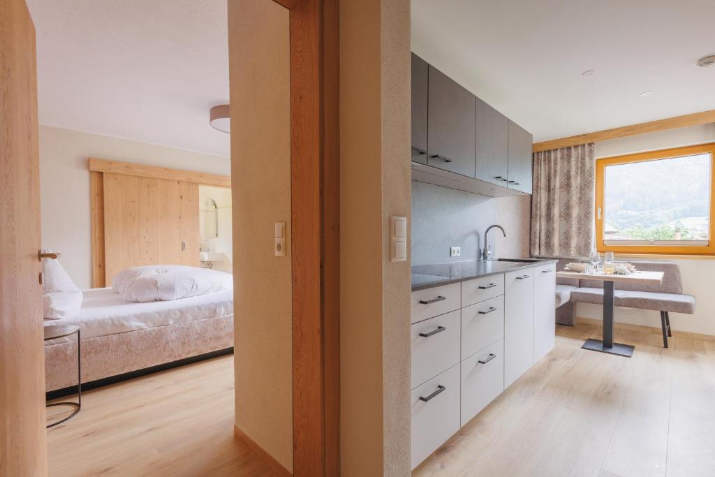 Postel nebo postele na pokoji v ubytování hin&weg das Aparthotel
