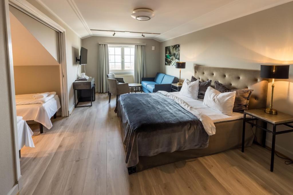 Postel nebo postele na pokoji v ubytování Klækken Hotel