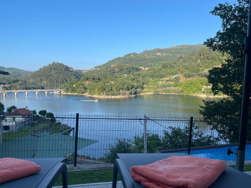 a view of a river from a balcony at Estrela do Geres in Geres