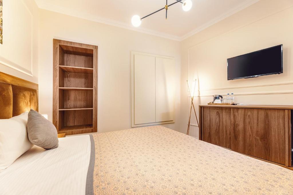 Postel nebo postele na pokoji v ubytování Boutique Hotel Manufactura