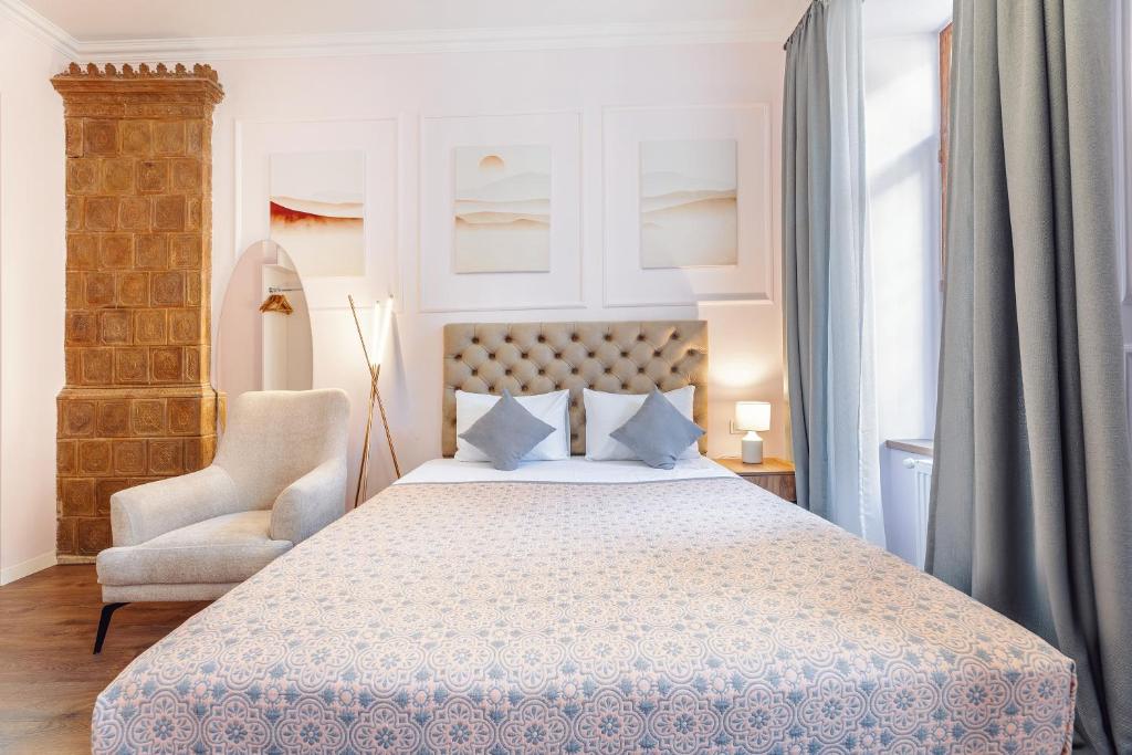 Postel nebo postele na pokoji v ubytování Boutique Hotel Manufactura