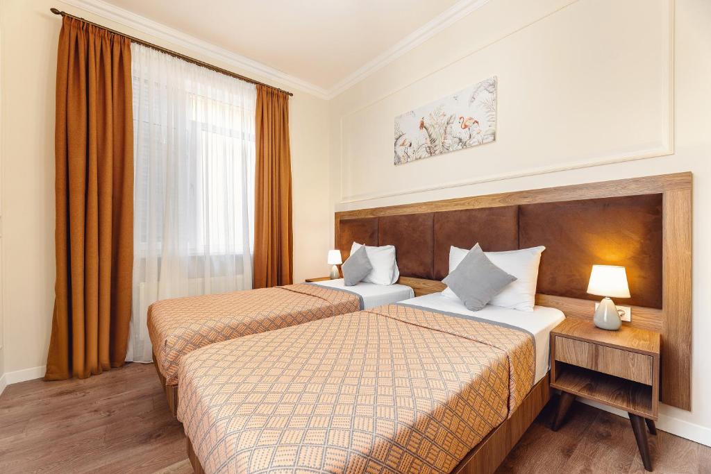 Postel nebo postele na pokoji v ubytování Boutique Hotel Manufactura
