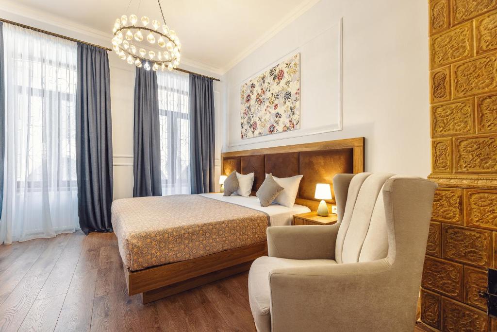 Postel nebo postele na pokoji v ubytování Boutique Hotel Manufactura