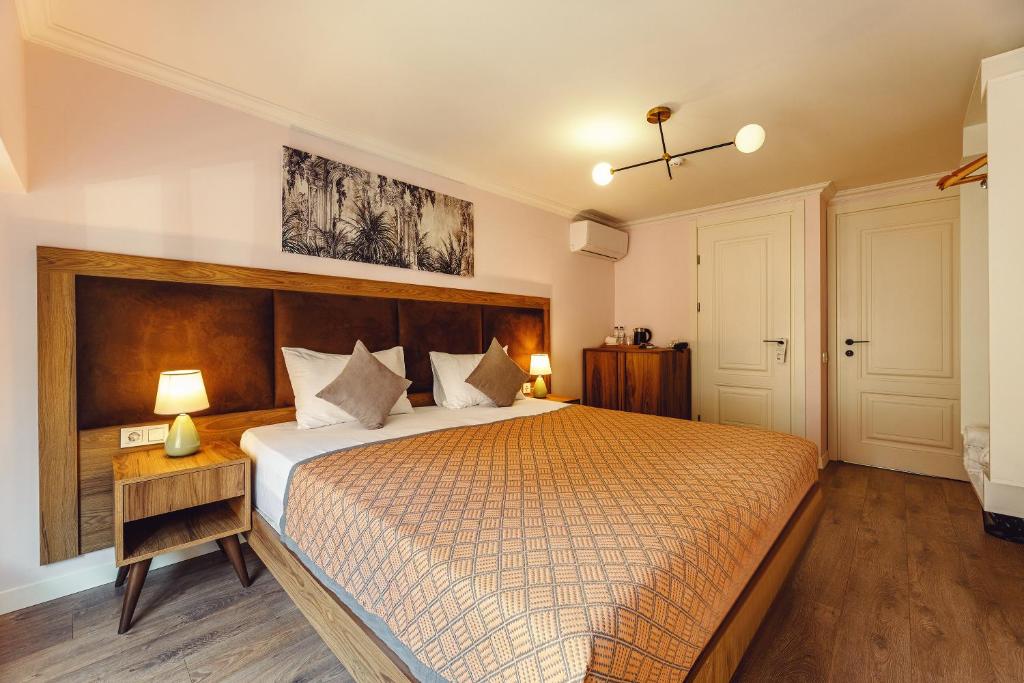 Postel nebo postele na pokoji v ubytování Boutique Hotel Manufactura