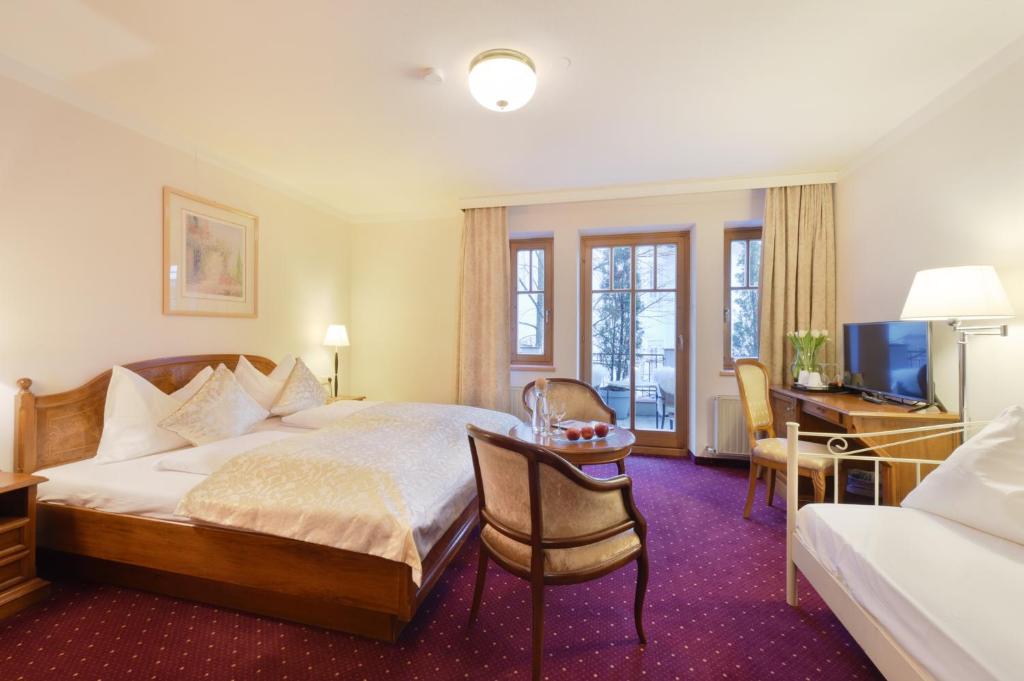Postel nebo postele na pokoji v ubytování Cella Central Historic Boutique Hotel