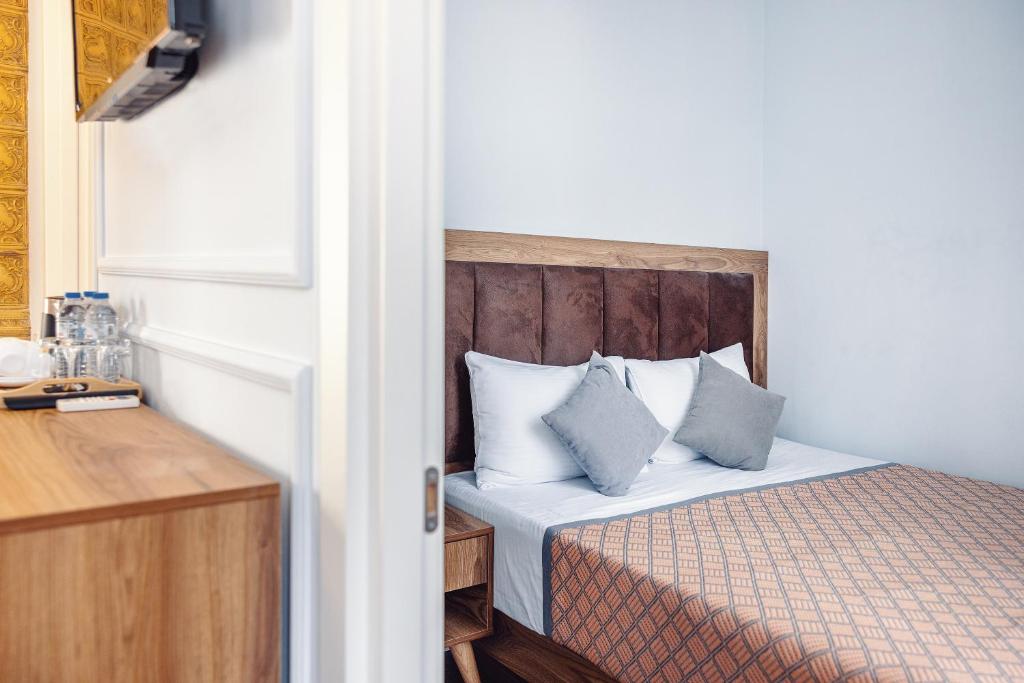 Postel nebo postele na pokoji v ubytování Boutique Hotel Manufactura