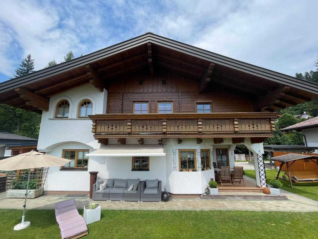 a large house with a wooden roof at Appartement Thunhart Wilfried&Elisabeth in Altenmarkt im Pongau