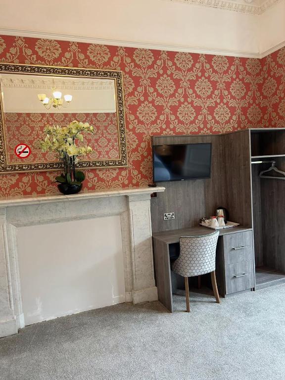 TV o dispositivi per l'intrattenimento presso Arrandale Guest House