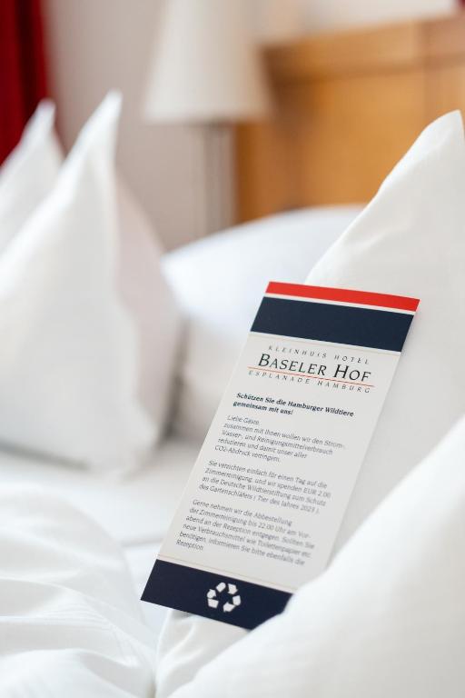 Postel nebo postele na pokoji v ubytování Hotel Baseler Hof