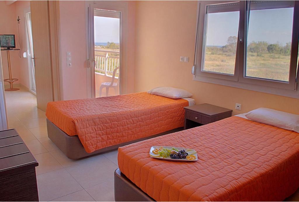 Postel nebo postele na pokoji v ubytování Grand Platon Hotel