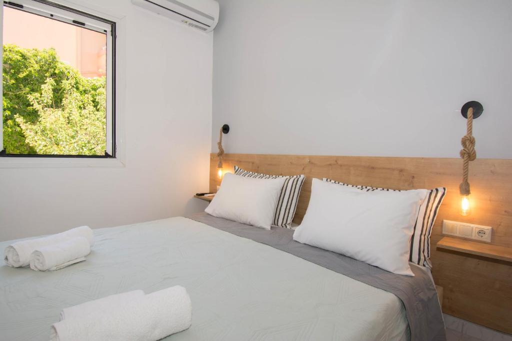 Postel nebo postele na pokoji v ubytování Jasmine Suites "By Checkin"