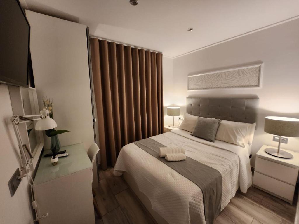 Postel nebo postele na pokoji v ubytování DON LEONE Hotel