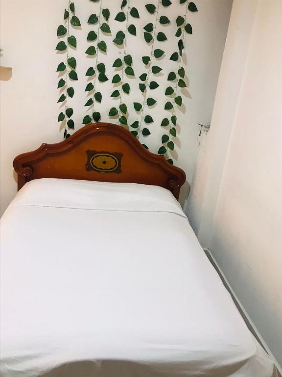 Postel nebo postele na pokoji v ubytování hostal la 18