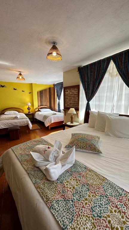 Postel nebo postele na pokoji v ubytování Hotel Donde Ivan