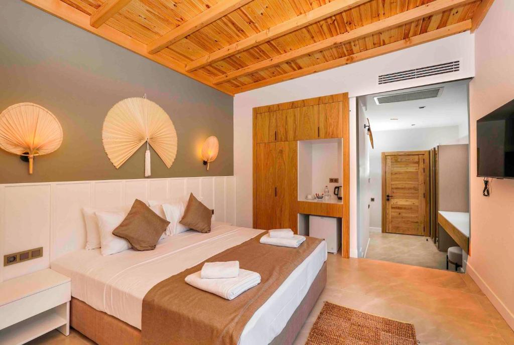 Postel nebo postele na pokoji v ubytování Likya Gardens Hotel