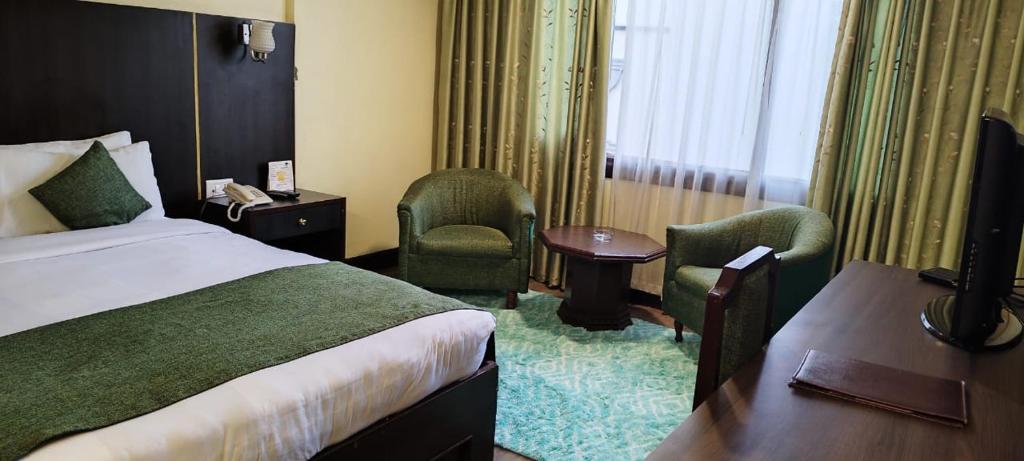 Postel nebo postele na pokoji v ubytování Hotel Vaishali