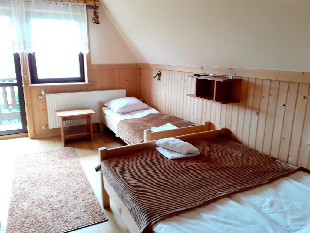 Posteľ alebo postele v izbe v ubytovaní Dom Wypoczynkowy Grań