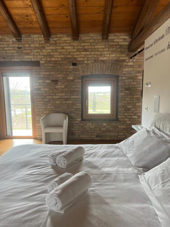 Postel nebo postele na pokoji v ubytování B&B La Corte Dei Vizi