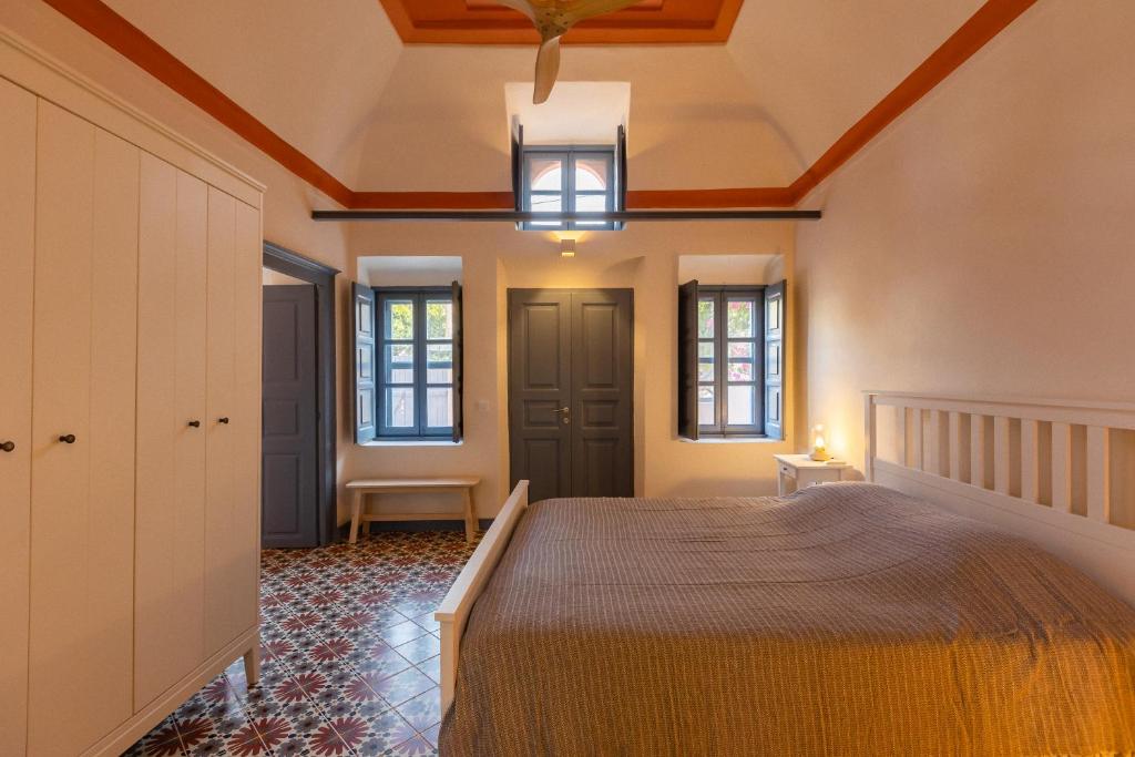 a bedroom with a bed and a ceiling at St.Mammas Traditional Apartment in Mesaria