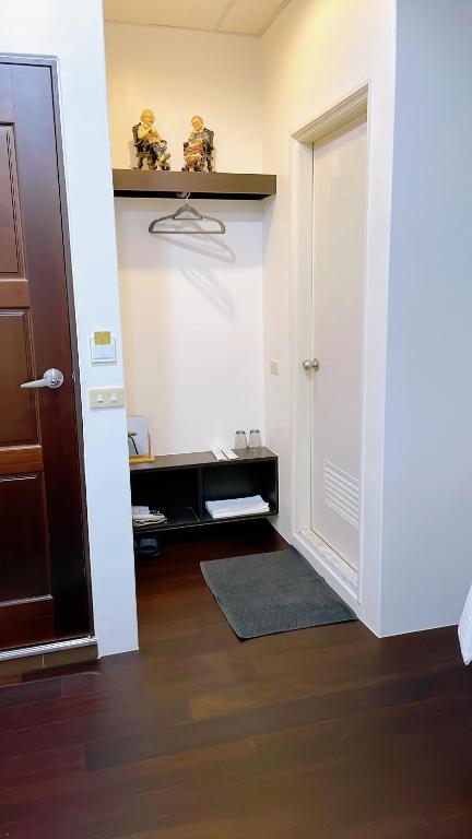 a hallway with a door and a room with a floor at Sun B&amp;B in Taitung City