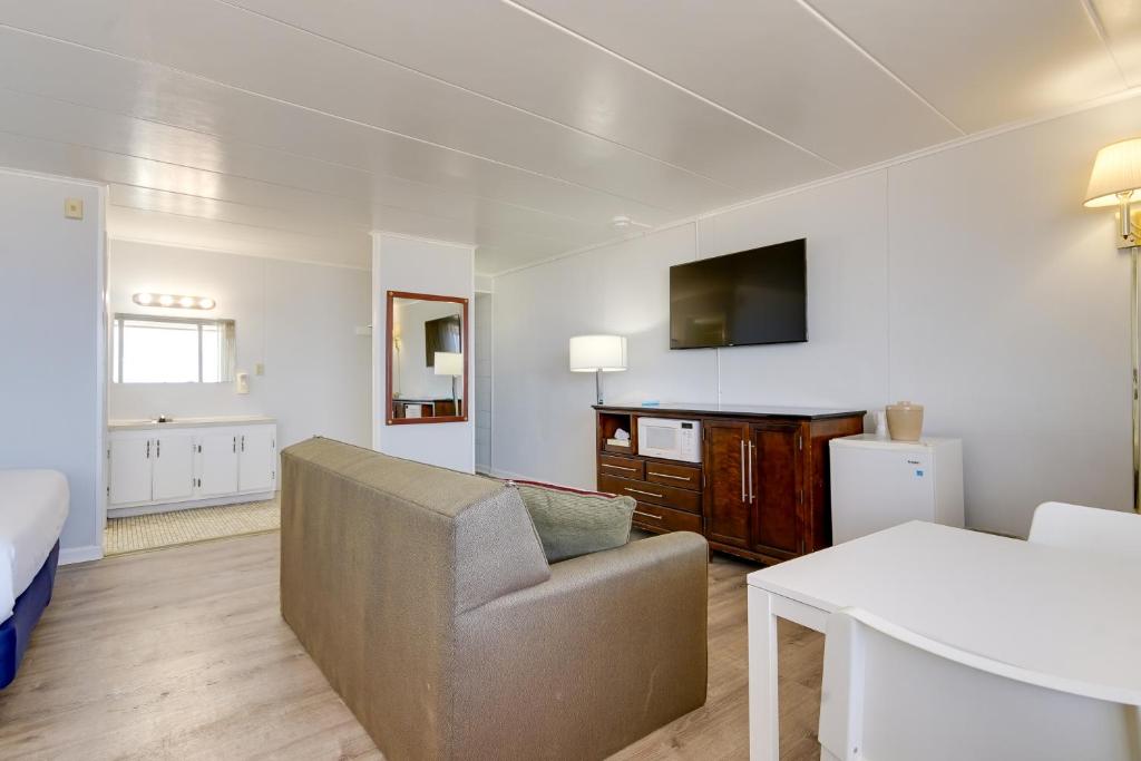 a living room with a couch and a table at Rideau Oceanfront Motel in Ocean City