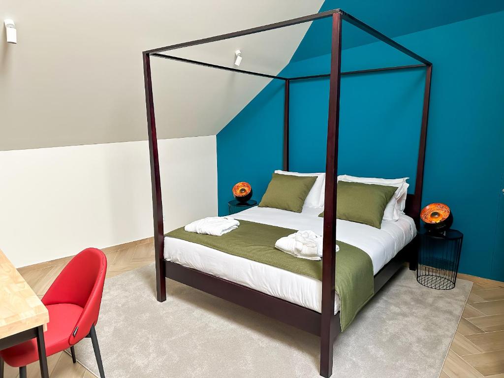 Postel nebo postele na pokoji v ubytování Guest House Jacarandá Faro