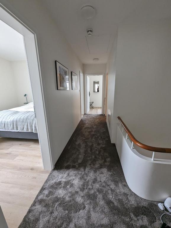 Rúm í herbergi á The Ísafjörður Inn by Ourhotels