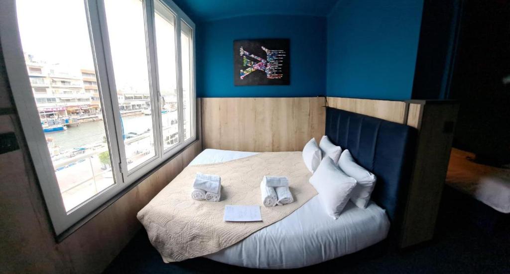 Postel nebo postele na pokoji v ubytování Hôtel les 4 éléments