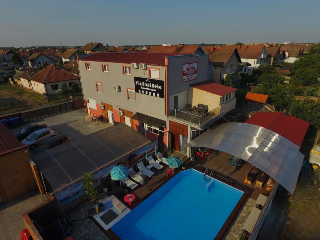 an overhead view of a house with a swimming pool at Apartments Vila Brzi & Beka in Šabac