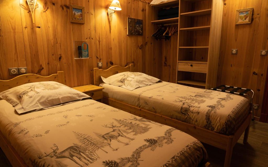 Postel nebo postele na pokoji v ubytování Hôtel Quin Te Va