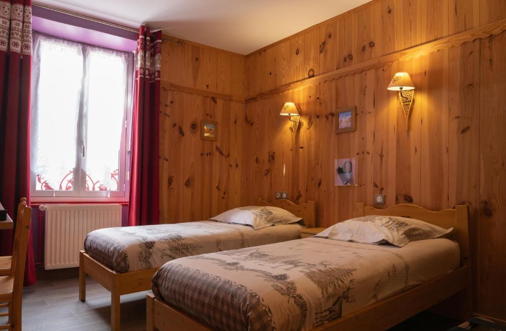 Postel nebo postele na pokoji v ubytování Hôtel Quin Te Va