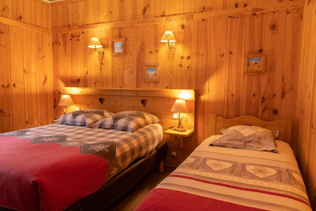 Postel nebo postele na pokoji v ubytování Hôtel Quin Te Va