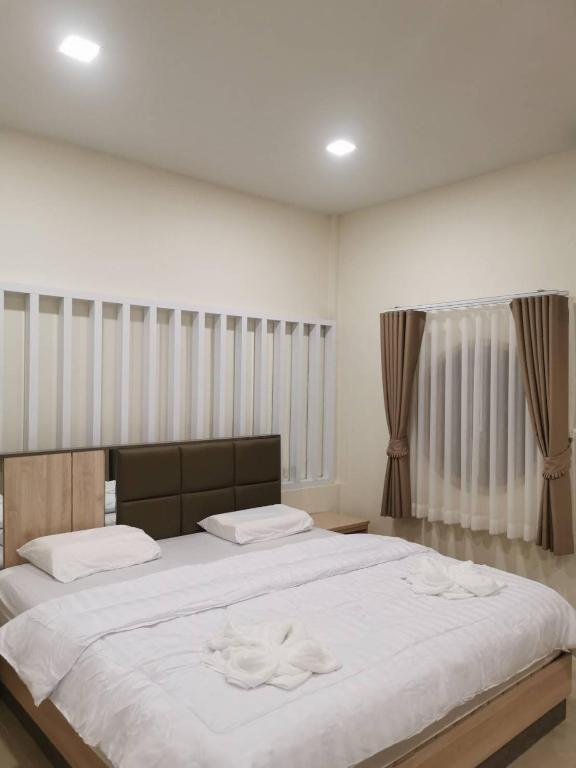 NST Boutique เอ็นเอสทีบูทีค - King Room Mit Gartenansicht