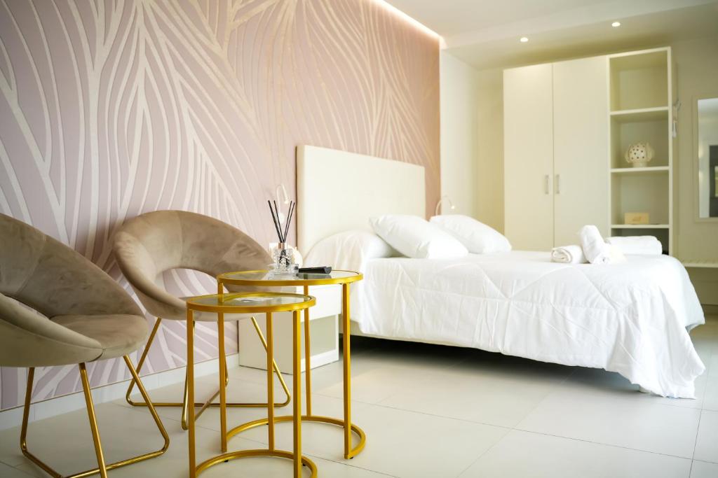 Letto o letti in una camera di Sirena Suite Deluxe
