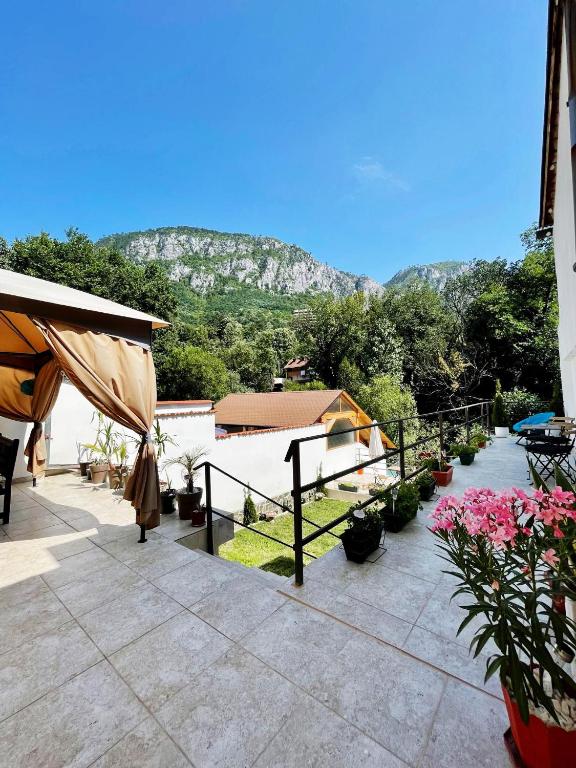 a patio with a view of a mountain at Casa Anca in Băile Herculane