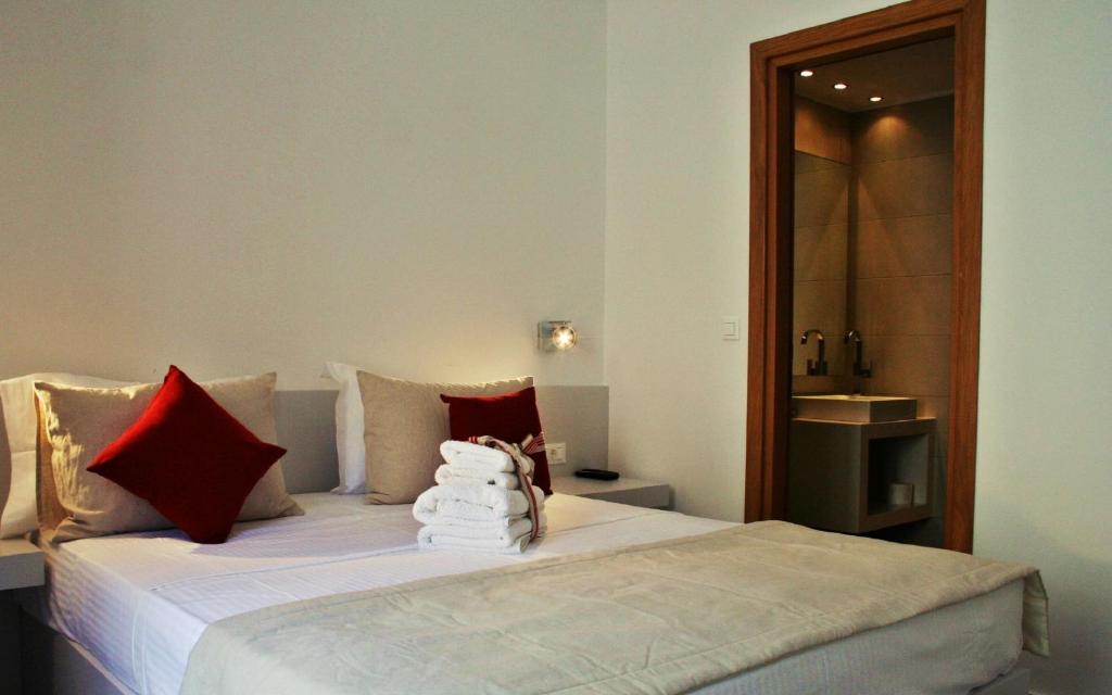 A bed or beds in a room at Lindos Beauty