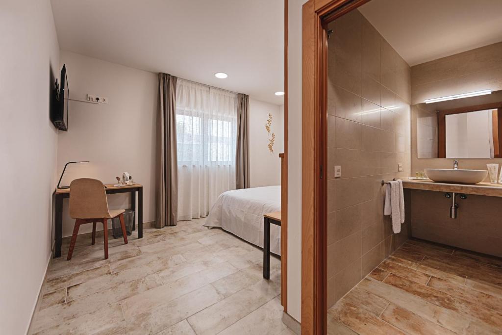 Posteľ alebo postele v izbe v ubytovaní Hotel rural La Tejera