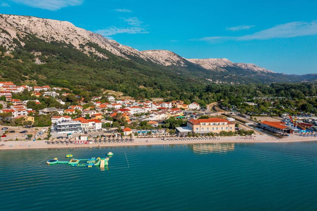 an aerial view of a beach with boats in the water at Hotel Dobrovit in Baška