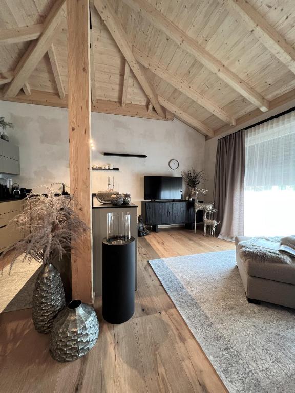 a large living room with a couch and a table at BergSoul in Garmisch-Partenkirchen